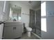 Modern bathroom features a glass-enclosed shower, marble countertop, and stylish fixtures at 120 Parker Ln, Mebane, NC 27302
