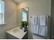 Bathroom featuring a sink with towels, a vanity mirror, and modern finishes at 120 Parker Ln, Mebane, NC 27302