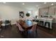 Dining room area features a dining table with pink chairs adjacent to the kitchen at 120 Parker Ln, Mebane, NC 27302