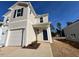 Charming two-story home with attached garage, landscaped yard, and modern design at 120 Parker Ln, Mebane, NC 27302
