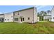 The back of the house shows newly planted lawn and a small deck at 1216 Dimaggio Dr # 29, Raleigh, NC 27616