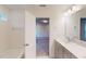 Bright bathroom with tub, shower, and single sink vanity at 1216 Dimaggio Dr # 29, Raleigh, NC 27616