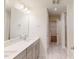 Bright bathroom with double sinks, tiled floors, walk-in shower, and a linen closet at 1216 Dimaggio Dr # 29, Raleigh, NC 27616