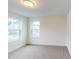 A well-lit bedroom with views of the neighborhood through the windows at 1216 Dimaggio Dr # 29, Raleigh, NC 27616
