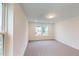 A carpeted bedroom featuring windows that allow natural light and views of neighborhood at 1216 Dimaggio Dr # 29, Raleigh, NC 27616