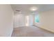Bedroom with carpet floors, a window, and an adjoining bathroom entrance at 1216 Dimaggio Dr # 29, Raleigh, NC 27616