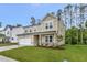 A charming two-story home featuring a two-car garage and manicured landscaping at 1216 Dimaggio Dr # 29, Raleigh, NC 27616