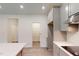 Charming kitchen with stainless steel appliances, subway tile backsplash, and a view to the pantry at 1216 Dimaggio Dr # 29, Raleigh, NC 27616