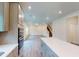 A modern, open-concept kitchen with stainless appliances, an island, wood floors, and lots of light at 1216 Dimaggio Dr # 29, Raleigh, NC 27616