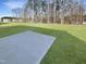 Backyard with concrete patio at 1221 Dimaggio Dr # 10, Raleigh, NC 27616