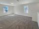 Spacious bonus room with neutral carpet and plenty of natural light at 1221 Dimaggio Dr # 10, Raleigh, NC 27616