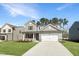 Two-story home featuring a two-car garage, manicured lawn, and neutral siding at 1221 Dimaggio Dr # 10, Raleigh, NC 27616