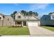 Two-story home featuring a two-car garage, manicured lawn, and neutral siding at 1221 Dimaggio Dr # 10, Raleigh, NC 27616