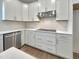 Bright kitchen featuring white cabinets, subway tile backsplash, and stainless steel appliances at 1221 Dimaggio Dr # 10, Raleigh, NC 27616