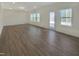 Bright and airy living room with hardwood floors, neutral walls, and a back door at 1221 Dimaggio Dr # 10, Raleigh, NC 27616
