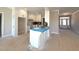 Bright eat-in kitchen with white cabinets, tile backsplash, and modern appliances at 1665 S Old Carriage Rd, Rocky Mount, NC 27804