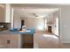 Kitchen flows into a living room with a fireplace, providing a warm and inclusive atmosphere at 1665 S Old Carriage Rd, Rocky Mount, NC 27804