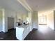 Modern kitchen with white cabinets, a center island with sink, and stainless steel appliances at 1665 S Old Carriage Rd, Rocky Mount, NC 27804