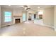Open living room featuring a decorative fireplace, natural light, and neutral paint at 1665 S Old Carriage Rd, Rocky Mount, NC 27804