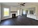 Bright living room featuring dark wood floors, fireplace, and an open floor plan at 1665 S Old Carriage Rd, Rocky Mount, NC 27804