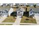 Aerial view of the home featuring a well-maintained yard and a long driveway at 2117 Attend Xing, Fuquay Varina, NC 27526