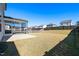 Expansive backyard featuring a screened in porch and a spacious grassy area at 2117 Attend Xing, Fuquay Varina, NC 27526