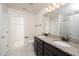 Bathroom featuring double vanity, granite counters, framed mirror, and shower at 2117 Attend Xing, Fuquay Varina, NC 27526