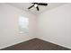 Bright bedroom featuring a ceiling fan, window, and wood-look flooring at 2117 Attend Xing, Fuquay Varina, NC 27526