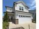 Charming two-story home featuring a two-car garage, light gray siding, and well-maintained landscaping at 2117 Attend Xing, Fuquay Varina, NC 27526