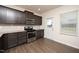 Modern kitchen with stainless steel appliances, granite countertops, stylish cabinets and vinyl wood plank flooring at 2117 Attend Xing, Fuquay Varina, NC 27526