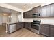 Modern kitchen with stainless steel appliances and granite countertops at 2117 Attend Xing, Fuquay Varina, NC 27526