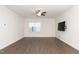 Bright and airy living room with vinyl wood plank flooring and a modern ceiling fan at 2117 Attend Xing, Fuquay Varina, NC 27526