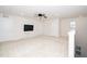Large loft with neutral carpet, ceiling fan, television, and two closets at 2117 Attend Xing, Fuquay Varina, NC 27526