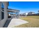 Spacious screened-in porch adjacent to a concrete patio and a lush backyard at 2117 Attend Xing, Fuquay Varina, NC 27526