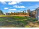 Large backyard featuring a storage shed and a screened porch with a fire pit at 3217 Satterwhite Point Rd, Henderson, NC 27537