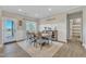 Bright dining area with farmhouse decor, comfortable seating, and easy access to the outdoor space at 3217 Satterwhite Point Rd, Henderson, NC 27537