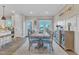 Inviting dining area with backyard views, farmhouse decor, and elegant furnishings at 3217 Satterwhite Point Rd, Henderson, NC 27537