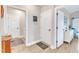 Hallway that features coat storage, laundry access, and doorway at 3217 Satterwhite Point Rd, Henderson, NC 27537