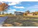 Gray house with a large yard, and mature trees at 3217 Satterwhite Point Rd, Henderson, NC 27537
