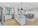 Spacious kitchen with a large island, stainless steel appliances, and plenty of counter space for meal preparation at 3217 Satterwhite Point Rd, Henderson, NC 27537