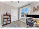 Bright office with a bookcase, desk with dual monitors, and natural light at 3217 Satterwhite Point Rd, Henderson, NC 27537