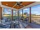 Relaxing screened porch featuring comfortable seating and scenic backyard views, perfect for unwinding at 3217 Satterwhite Point Rd, Henderson, NC 27537