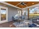 Comfortable screened porch provides a cozy outdoor living space with stylish furniture and scenic views at 3217 Satterwhite Point Rd, Henderson, NC 27537