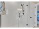 Bright bathroom shower features white tile surround, glass door, and bronze fixtures at 3217 Satterwhite Point Rd, Henderson, NC 27537