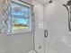 Shower with clear doors showcasing the countryside at 3217 Satterwhite Point Rd, Henderson, NC 27537
