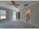 Bright and spacious bedroom with large windows, ceiling fan, and ensuite bathroom access at 102 Roma Gora Ct, Princeton, NC 27569