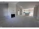 Bright living room featuring high ceilings, fireplace, and an open layout that leads to the kitchen at 102 Roma Gora Ct, Princeton, NC 27569