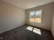 Bright bedroom with a large window and plush carpet flooring at 103 Roma Gora Ct, Princeton, NC 27569