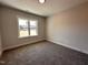 Bright bedroom featuring a window and carpeted flooring, offering a comfortable living space at 103 Roma Gora Ct, Princeton, NC 27569