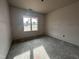 Unfinished bedroom with a window and ample space at 103 Roma Gora Ct, Princeton, NC 27569